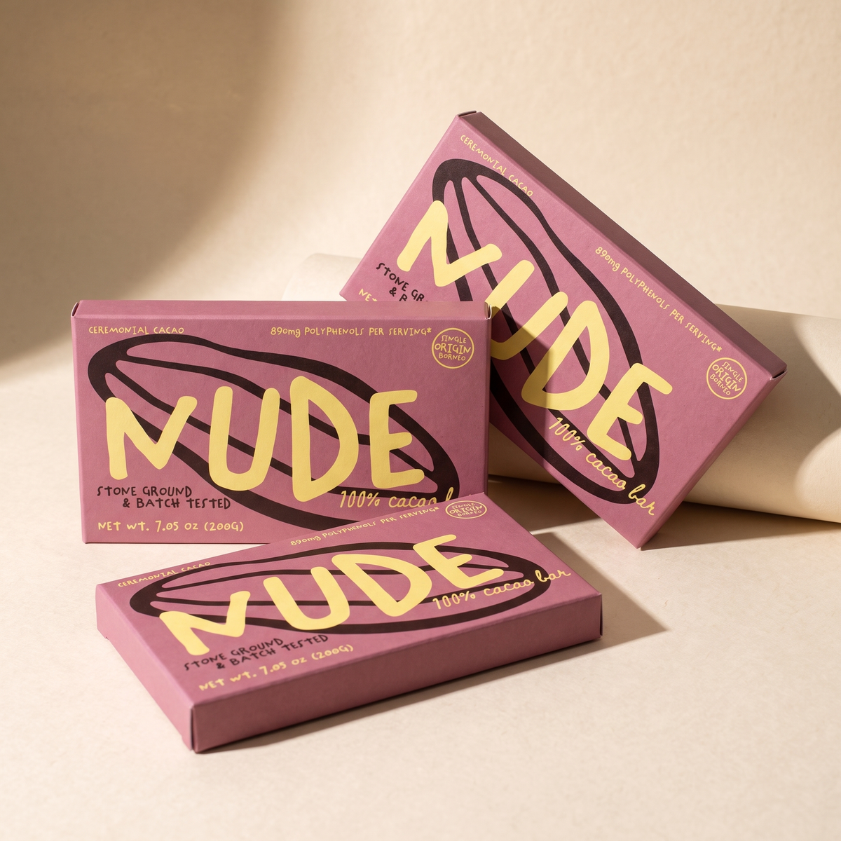 Three pink NUDE cacao sleeves standing together