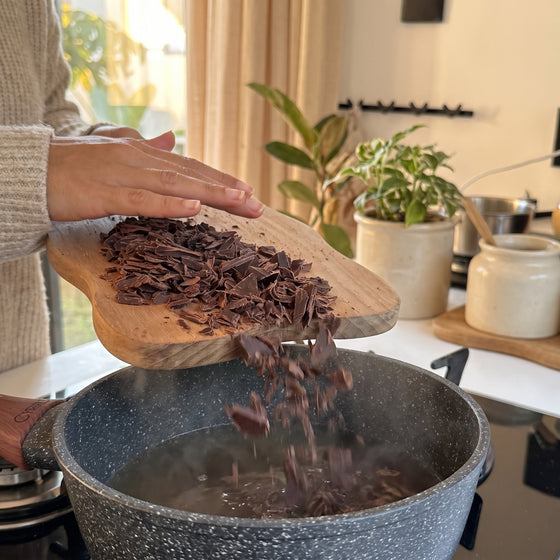 The piece melting into steaming milk